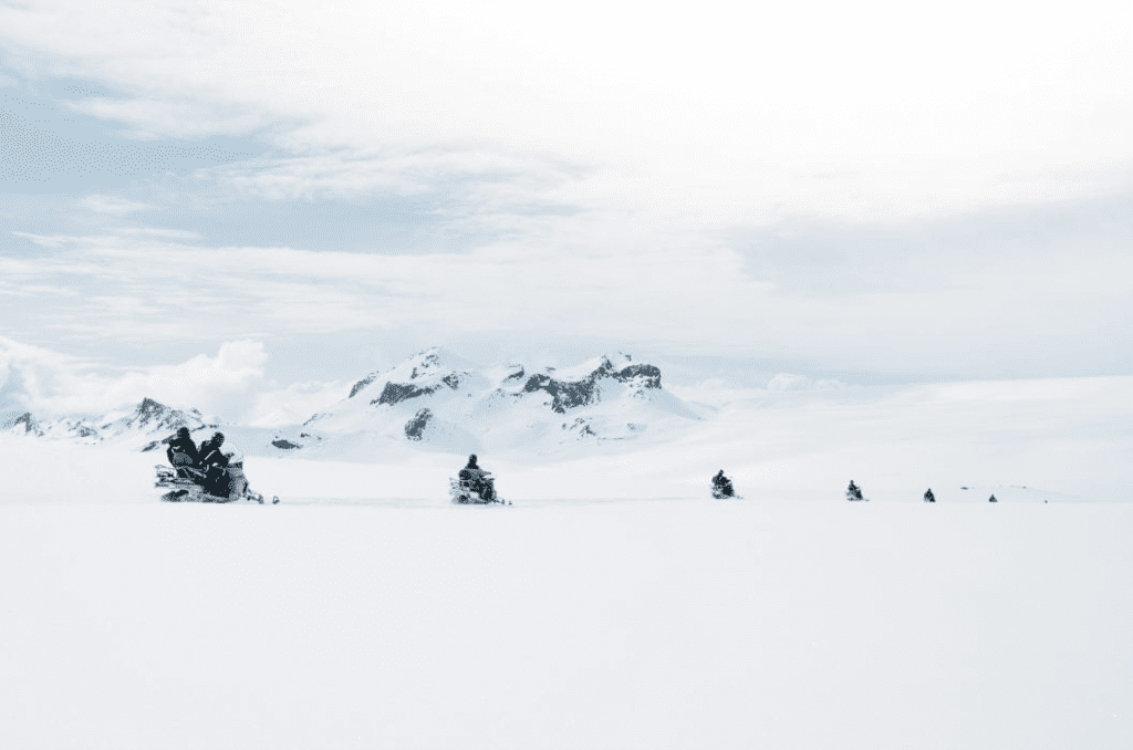 Snowmobiles in a row